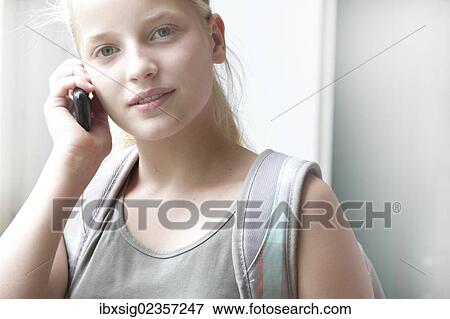 Girl talking on a mobile phone View Large Photo Image Stock Photo - Girl talking on a mobile phone. Fotosearch