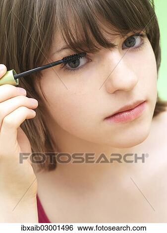 Stock Photograph - "Girl, teenager, applying make-up, mascara". Fotosearch