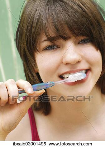 Stock Photography - "Girl, teenager, brushing her teeth". Fotosearch