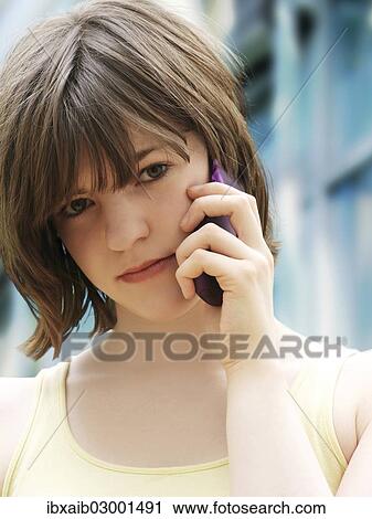 "Girl, teenager, making a call on a mobile phone" View Large Photo Image Stock Image - "Girl, teenager, making a call on a mobile phone". Fotosearch