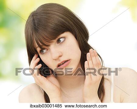 Stock Photography - "Girl, teenager, making a call on a mobile phone". Fotosearch