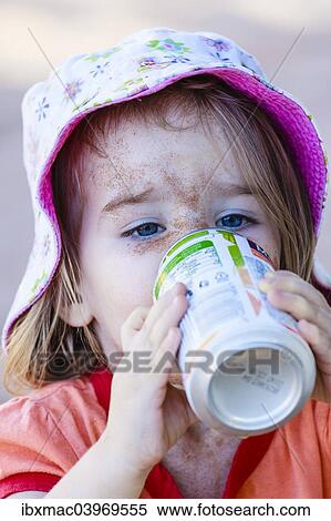 "Girl, two years, face caked in sand, drinking from beverage can, Namibia, Africa" View Large Photo Image Stock Photography - "Girl, two years, face caked in sand, drinking from beverage can, Namibia, Africa". Fotosearch