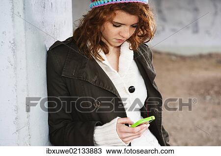 Girl using a mobile phone View Large Photo Image Stock Image - Girl using a mobile phone. Fotosearch