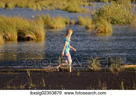 "Girl wading in a wet bog, Stammbecken Moor, former Nicklheim peat works, Rosenheim, Bavaria, Germany, Europe" View Large Photo Image Stock Photo - "Girl wading in a wet bog, Stammbecken Moor, former Nicklheim peat works, Rosenheim, Bavaria, Germany, Europe". Fotosearch