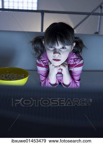 Girl watching television View Large Photo Image Stock Photo - Girl watching television. Fotosearch