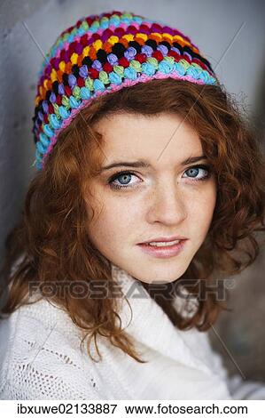 "Girl wearing a colourful woollen cap, portrait" View Large Photo Image Stock Photo - "Girl wearing a colourful woollen cap, portrait". Fotosearch