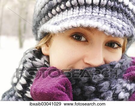 Stock Photo - Girl wearing a hat and a scarf. Fotosearch