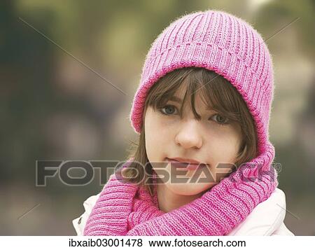 "Girl with a pink woolly hat, portrait" View Large Photo Image Stock Photo - "Girl with a pink woolly hat, portrait". Fotosearch
