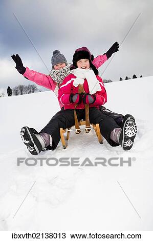 Girls sledging View Large Photo Image Stock Image - Girls sledging. Fotosearch