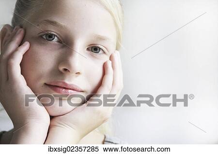 "Girls supporting her face in her hands, portrait" View Large Photo Image Stock Photography - "Girls supporting her face in her hands, portrait". Fotosearch