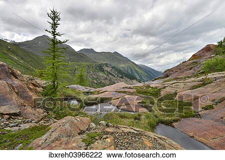 Stock Image - "Glacial fluting at Mt Gepatschferner, at the back Mt Ochsenkopf and the Gratfernerkopf mountains, Kaunertal Glacier, Otztal Alps, Tyrol, Austria, Europe". Fotosearch