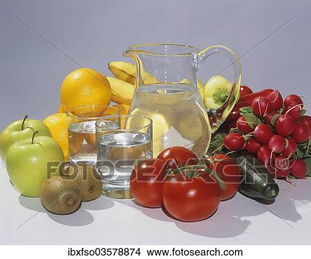 "Glass carafe filled with water, two glasses, fruit and vegetables" View Large Photo Image Picture - "Glass carafe filled with water, two glasses, fruit and vegetables". Fotosearch