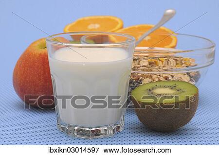 "Glass of milk, cereal or muesli, kiwi, apple and orange" View Large Photo Image Stock Photo - "Glass of milk, cereal or muesli, kiwi, apple and orange". Fotosearch