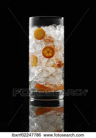 Glass prepared for a cocktail with ice cubes and decorations View Large Photo Image Stock Photograph - Glass prepared for a cocktail with ice cubes and decorations. Fotosearch