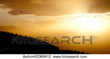 Glider at sunset View Large Photo Image Stock Image - Glider at sunset. Fotosearch
