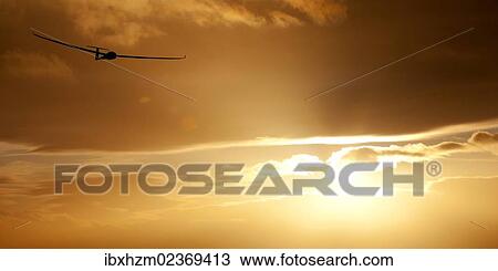 Glider at sunset View Large Photo Image Stock Image - Glider at sunset. Fotosearch