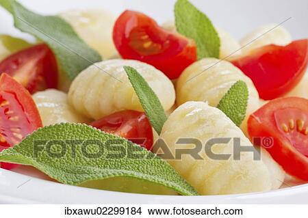 Picture - "Gnocchi, tomatoes, basil". Fotosearch