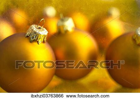 Golden Christmas baubles View Large Photo Image Stock Photograph - Golden Christmas baubles. Fotosearch