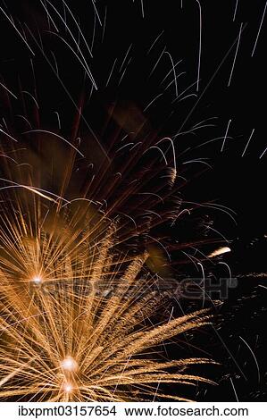 Picture - "Golden fireworks in the night sky, Laval, Quebec Province, Canada, North America". Fotosearch