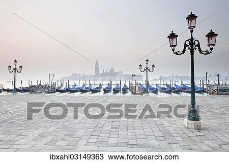 Stock Image - "Gondolas and San Giorgio Maggiore at back, from St Mark's Square, Venice, Venezien, Italy, Europe". Fotosearch