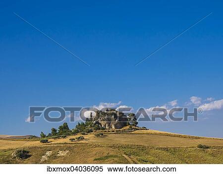 "Grain fields with stone formation in Caltanissetta, Sicily, Italy, Europe" View Large Photo Image Stock Photography - "Grain fields with stone formation in Caltanissetta, Sicily, Italy, Europe". Fotosearch
