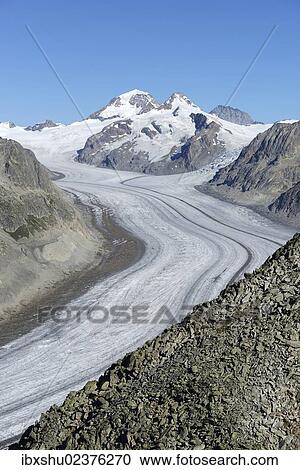 Stock Image - "Great Aletsch glacier, behind Mt. Eiger, Mt. Moench and Mt. Jungfrau, UNESCO World Heritage Site Swiss Alps Jungfrau-Aletsch, Goms, Valais, Switzerland, Europe". Fotosearch