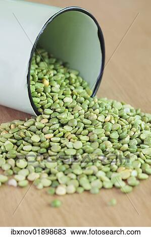 "Green split peas, spilled from a container" View Large Photo Image Stock Image - "Green split peas, spilled from a container". Fotosearch