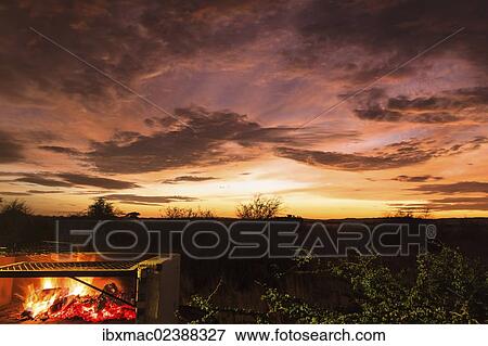 "Grill fire during an African sunset, Namibia, Africa" View Large Photo Image Stock Photo - "Grill fire during an African sunset, Namibia, Africa". Fotosearch