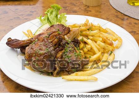 Grilled chicken leg with French fries View Large Photo Image Stock Image - Grilled chicken leg with French fries. Fotosearch