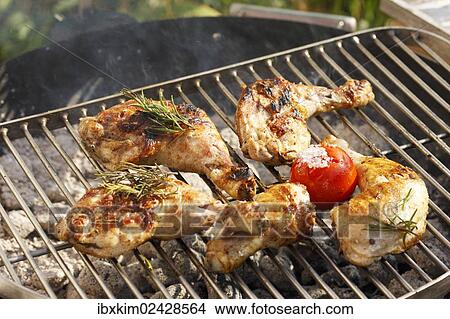 Grilled chicken legs on a grill rack View Large Photo Image Picture - Grilled chicken legs on a grill rack. Fotosearch