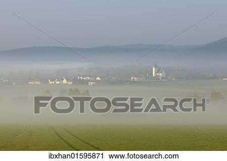 "Grillenberg mountain in the morning mist, Berndorf, Triestingtal valley, Lower Austria, Austria, Europe" View Large Photo Image Stock Image - "Grillenberg mountain in the morning mist, Berndorf, Triestingtal valley, Lower Austria, Austria, Europe". Fotosearch