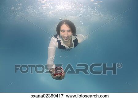 "Groom presenting ring, underwater wedding in pool, Odessa, Ukraine, Eastern Europe, Europe" View Large Photo Image Stock Photo - "Groom presenting ring, underwater wedding in pool, Odessa, Ukraine, Eastern Europe, Europe". Fotosearch