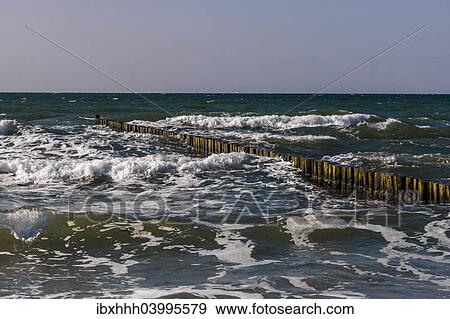 "Groynes at moderate swell on the beach of Ahrenshoop, Fischland, Mecklenburg-Western Pomerania, Germany, Europe" View Large Photo Image Stock Photo - "Groynes at moderate swell on the beach of Ahrenshoop, Fischland, Mecklenburg-Western Pomerania, Germany, Europe". Fotosearch
