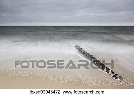 "Groynes in the waves, Sylt, Schleswig-Holstein, Germany, Europe" View Large Photo Image Stock Image - "Groynes in the waves, Sylt, Schleswig-Holstein, Germany, Europe". Fotosearch