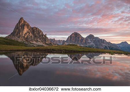 "Gusela mountain at sunrise reflected in small lake, Giau Pass, Dolomites, Veneto, Italy, Europe" View Large Photo Image Stock Image - "Gusela mountain at sunrise reflected in small lake, Giau Pass, Dolomites, Veneto, Italy, Europe". Fotosearch