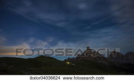"Gusela mountain in a starry night with clouds, Giau Pass, Dolomites, Veneto, Italy, Europe" View Large Photo Image Picture - "Gusela mountain in a starry night with clouds, Giau Pass, Dolomites, Veneto, Italy, Europe". Fotosearch