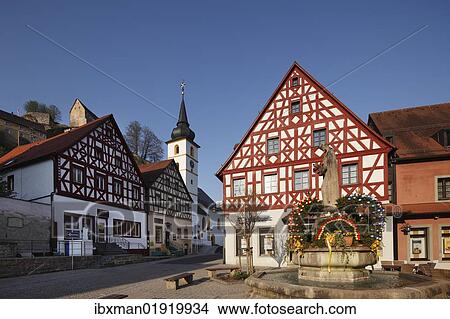 Picture - "Half-timbered houses and an Easter fountain, Pottenstein, Little Switzerland, Upper Franconia, Franconia, Bavaria, Germany, Europe". Fotosearch