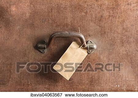 Handle and luggage tag of an old brown leather bag View Large Photo Image Stock Photo - Handle and luggage tag of an old brown leather bag. Fotosearch