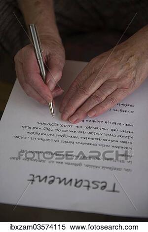 Stock Photography - "Hands of a 82-year-old woman signing a will, Germany, Europe". Fotosearch