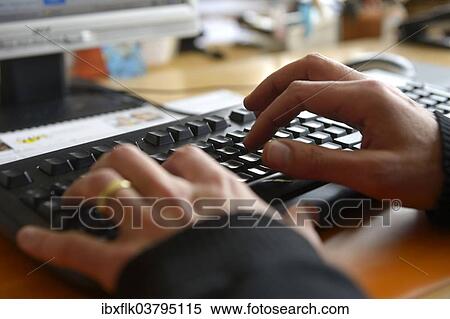 Stock Photography - Hands typing on a computer keyboard. Fotosearch