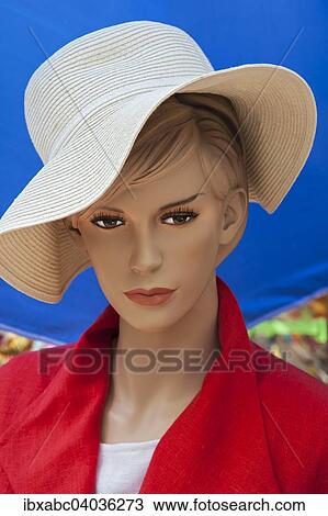 Stock Image - "Head of a fashion doll with hat, Auer Dult, Munich, Upper Bavaria, Bavaria, Germany, Europe". Fotosearch