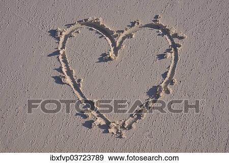 Heart drawn in the sand View Large Photo Image Stock Photo - Heart drawn in the sand. Fotosearch