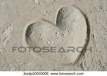 "Heart made of sand with the word LOVE made of shells, St Peter-Ording, Schleswig-Holstein, Germany, Europe" View Large Photo Image Stock Photograph - "Heart made of sand with the word LOVE made of shells, St Peter-Ording, Schleswig-Holstein, Germany, Europe". Fotosearch