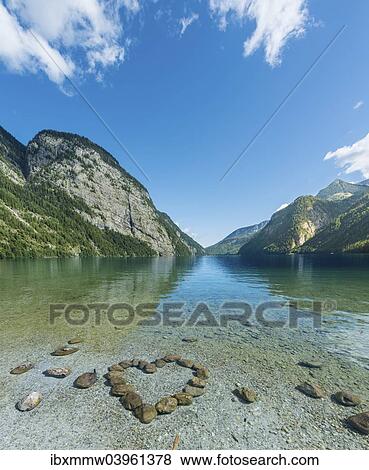 "Heart of stones in water, view over Lake Konigssee, Berchtesgaden National Park, Berchtesgadener Land district, Upper Bavaria, Bavaria, Germany, Europe" View Large Photo Image Stock Photo - "Heart of stones in water, view over Lake Konigssee, Berchtesgaden National Park, Berchtesgadener Land district, Upper Bavaria, Bavaria, Germany, Europe". Fotosearch