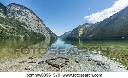 "Heart of stones in water, view over Lake Konigssee, Berchtesgaden National Park, Berchtesgadener Land district, Upper Bavaria, Bavaria, Germany, Europe" View Large Photo Image Stock Photo - "Heart of stones in water, view over Lake Konigssee, Berchtesgaden National Park, Berchtesgadener Land district, Upper Bavaria, Bavaria, Germany, Europe". Fotosearch