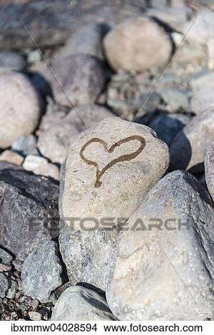 Heart painted on a stone with water View Large Photo Image Picture - Heart painted on a stone with water. Fotosearch