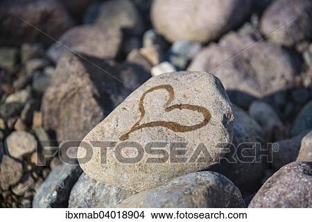 Heart painted on stone View Large Photo Image Picture - Heart painted on stone. Fotosearch