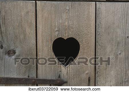 "Heart-shaped cut-out in the wooden door of a toilet, Lower Bavaria, Bavaria, Germany, Europe" View Large Photo Image Stock Photo - "Heart-shaped cut-out in the wooden door of a toilet, Lower Bavaria, Bavaria, Germany, Europe". Fotosearch