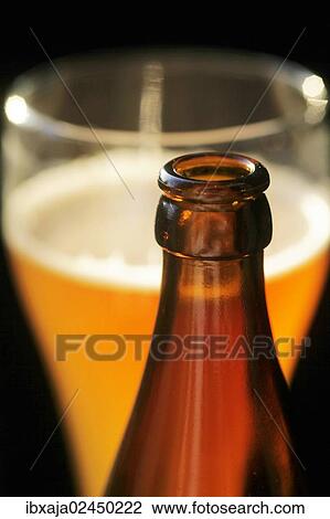 "Hefeweizen wheat beer, beer bottle in front of a wheat beer glass" View Large Photo Image Stock Image - "Hefeweizen wheat beer, beer bottle in front of a wheat beer glass". Fotosearch