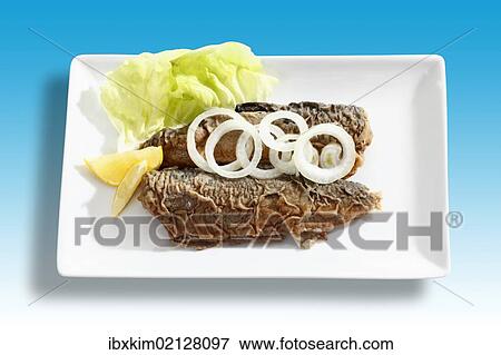 "Herrings from a can, garnished with onion rings" View Large Photo Image Stock Photo - "Herrings from a can, garnished with onion rings". Fotosearch